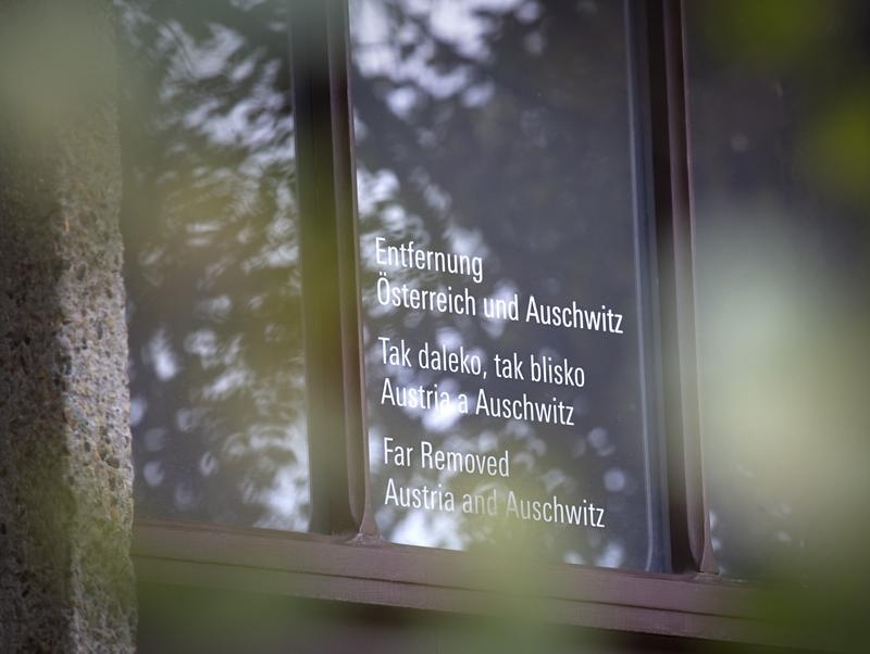 Window with exhibition title at Auschwitz-Birkenau