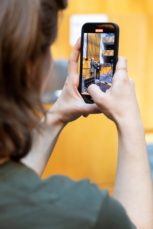 Veranstaltungsteilnehmer:in