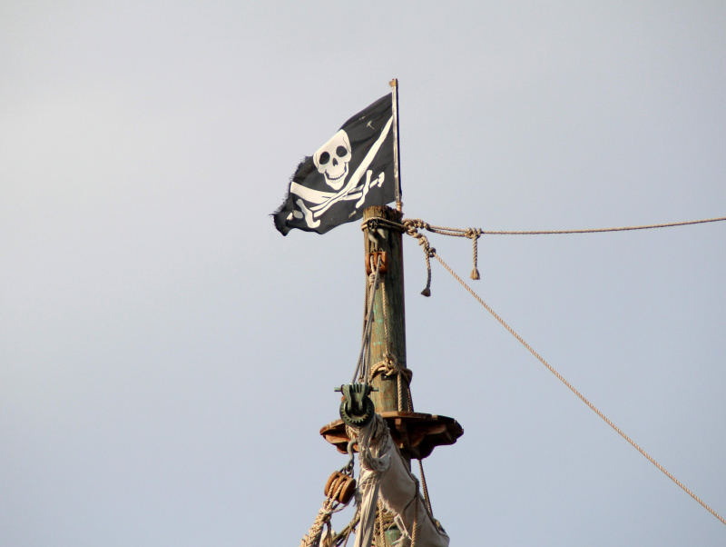A low angle shot of pirate flag on the ship